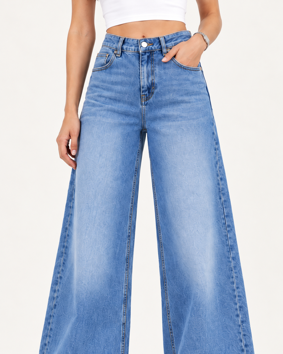 Waistband, front pockets and faded mid-blue denim detail