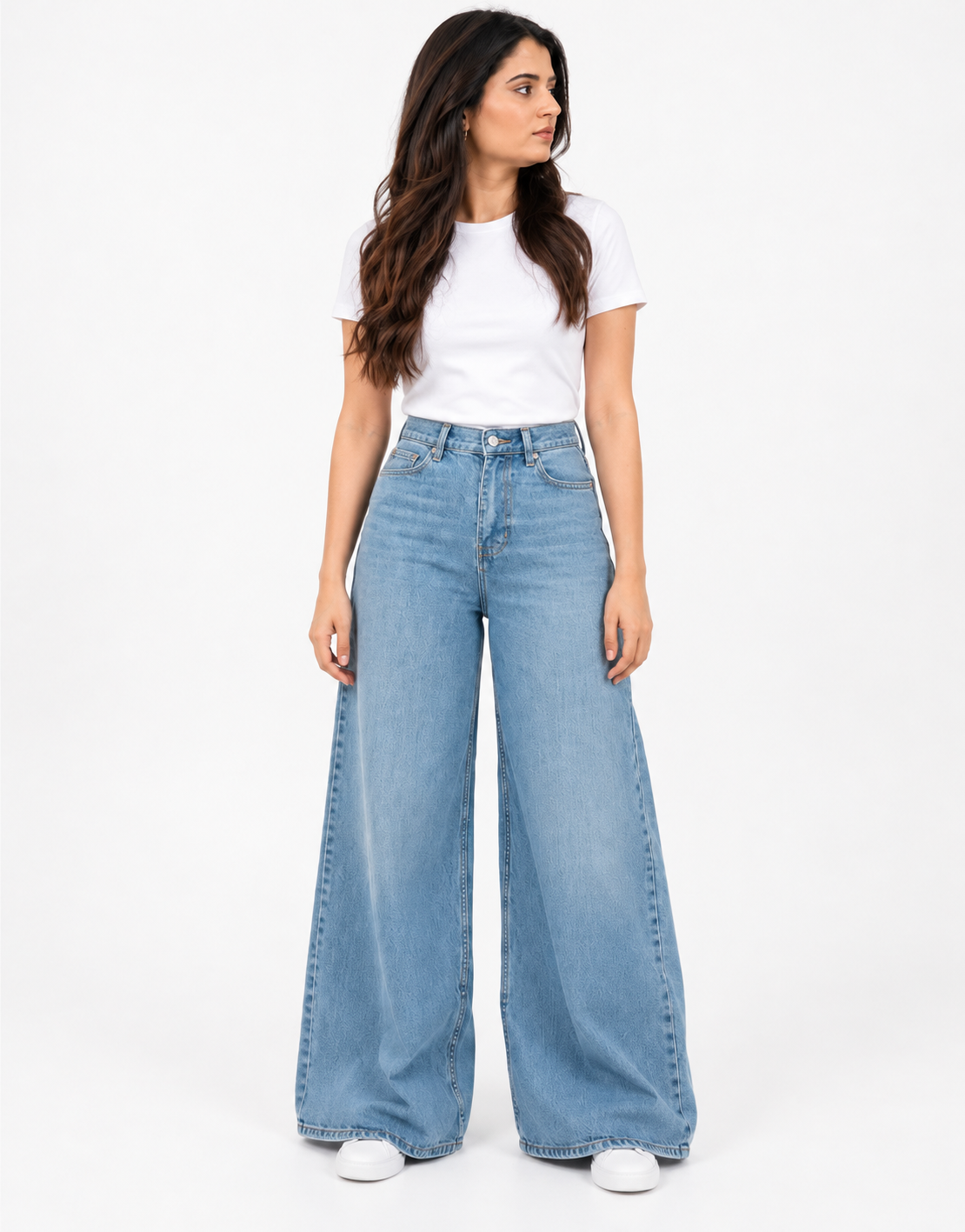 Front pose of faded mid-blue wide-leg jeans with a white tee